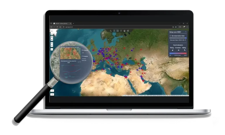 A laptop screen displaying the LaGrand web application map, showing industrial activity across Europe, the Middle East, and North Africa. A magnifying glass zooms in on a single steel plant in Germany, providing detailed decomposed activity data based on thermal analysis.