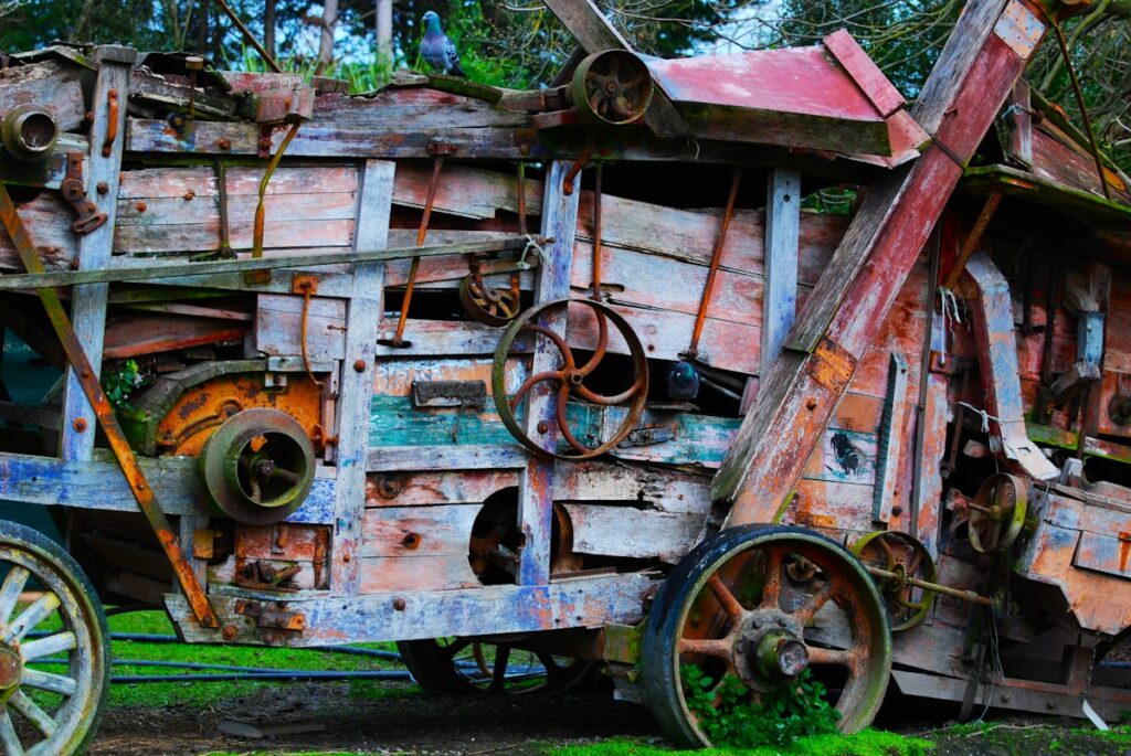 an old wooden wagon with rusted wheels