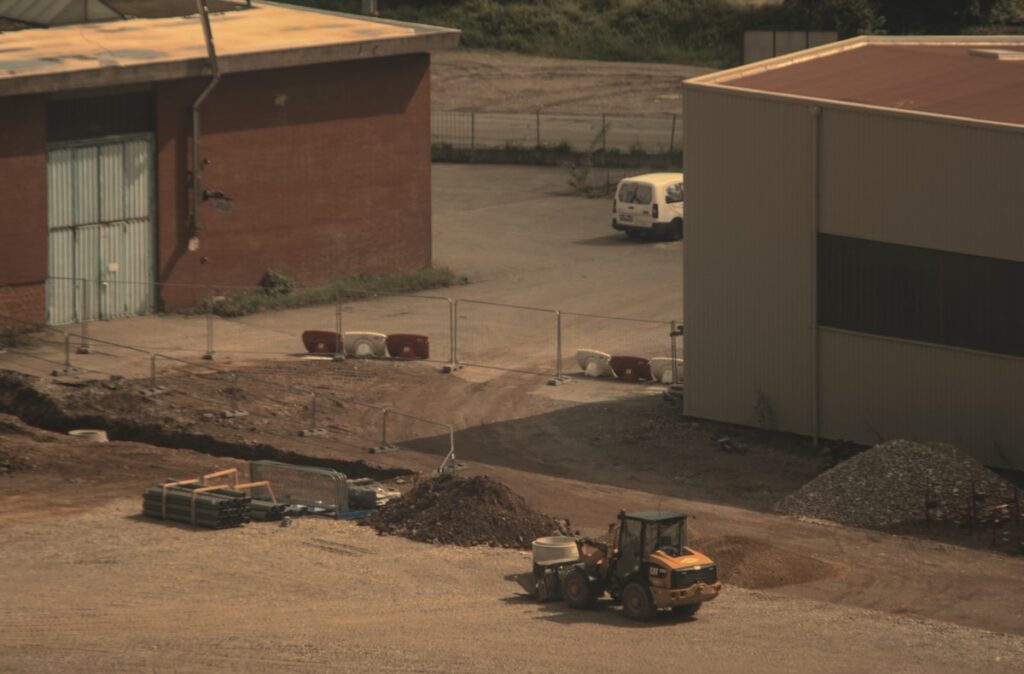a bulldozer is parked in front of a building