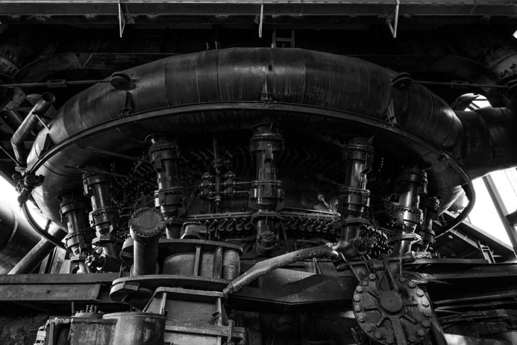 A black and white photo of a steam engine
