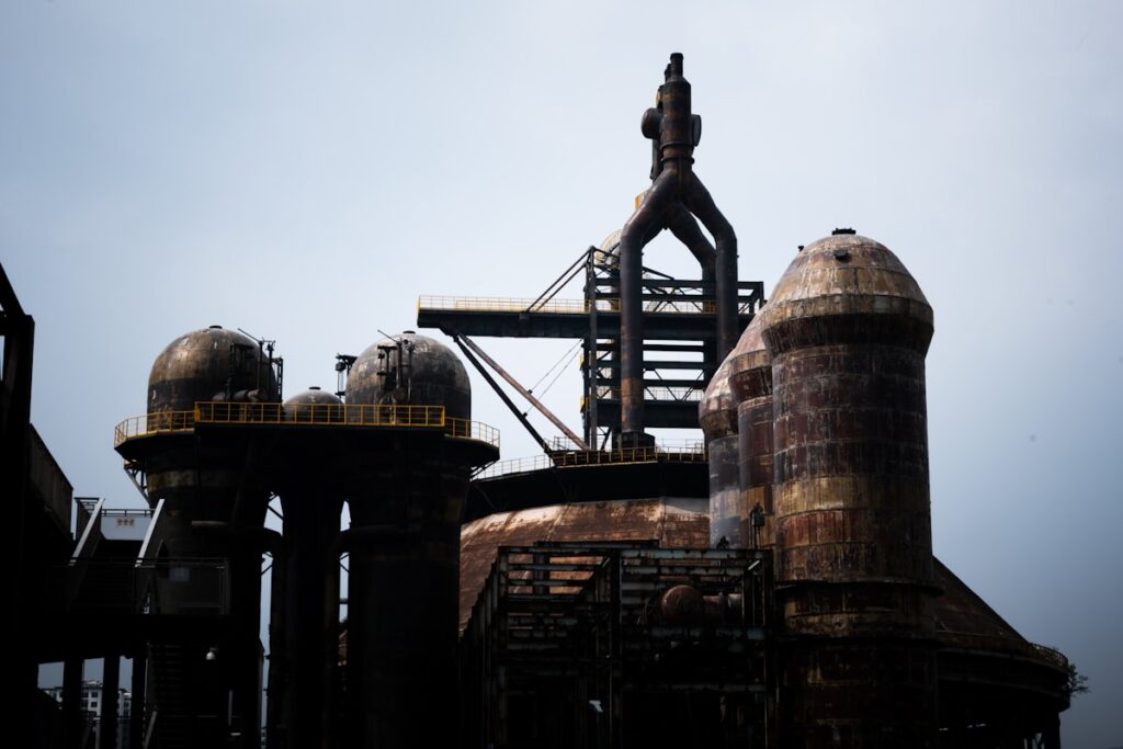 Industrial structures against a cloudy sky